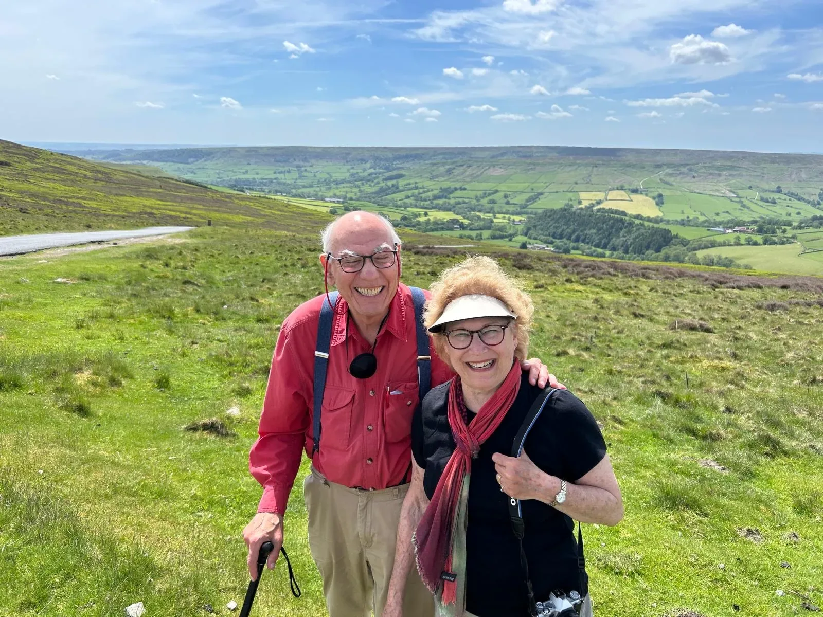 A happy couple stepping out of the Mercedes-Benz V-Class to take in a Yorkshire view on their private day tour from York